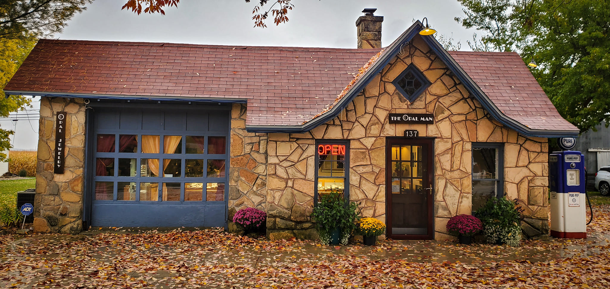 The storefront of The Opal Man in fall.