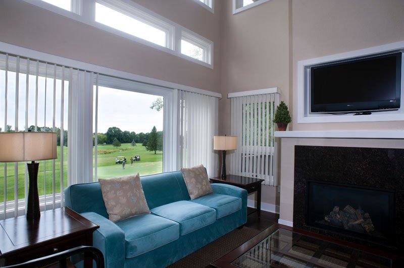 blue couch, picture window, and fireplace at Devils Head Resort