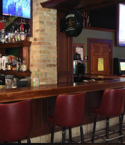 interior view of bar with red bar stools
