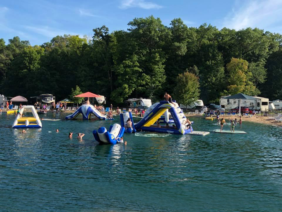 Kids playing on lake slide at Merry Macs